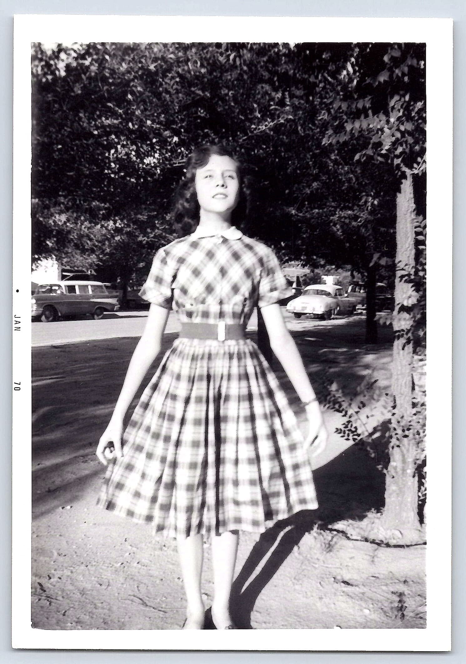 Girl in Plaid Dress, Black and White Photograph, 3.5 × 5 inches, 1970s