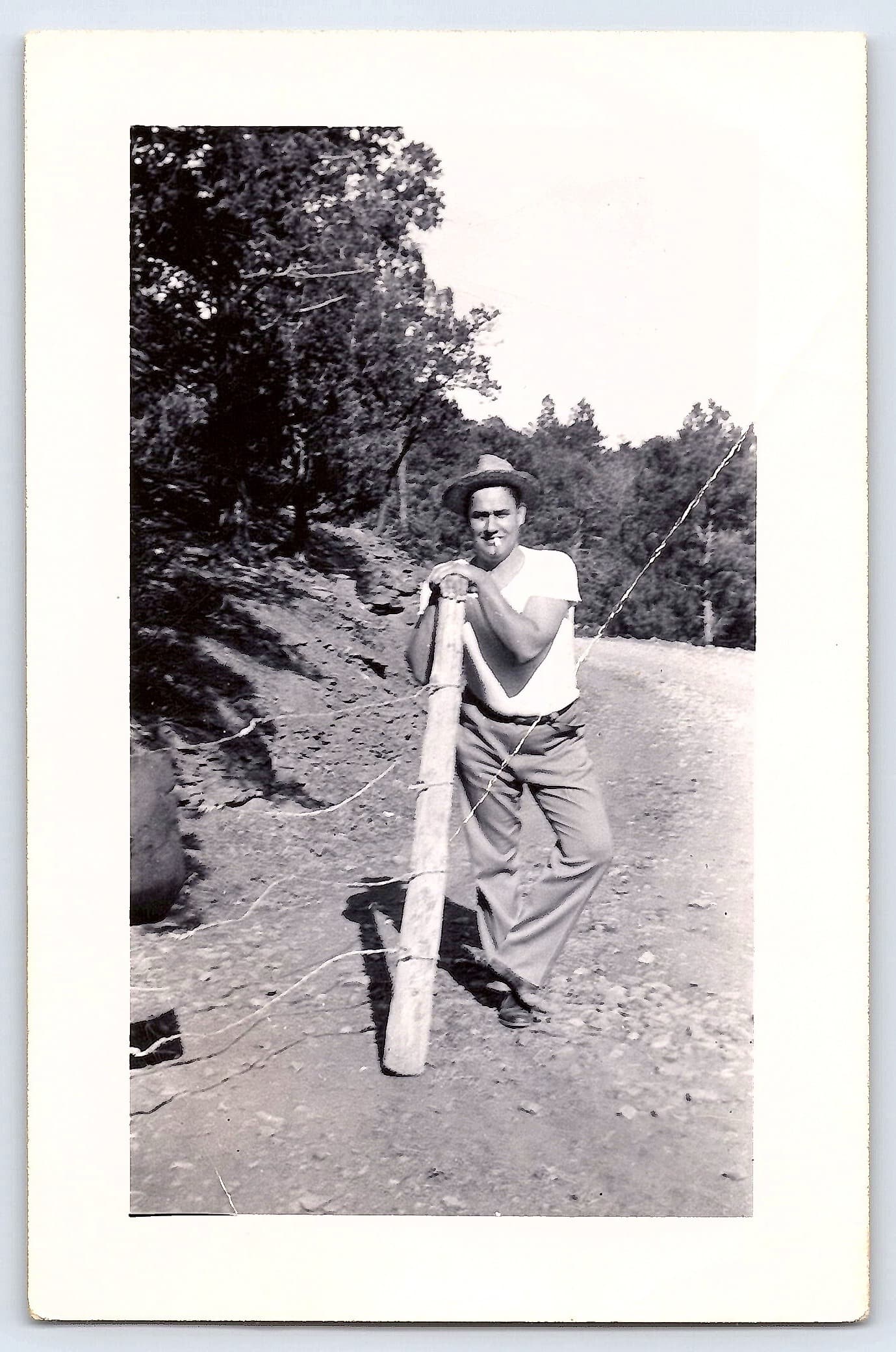 Man Leaning on Fence Post, Gelatin Silver Print, 3.21" × 4.96", 1950s